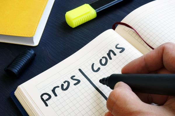 pros and cons written in notebook